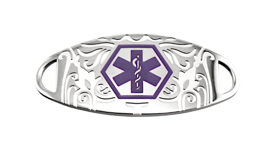 A stainless steel medical ID tag with purple scrollwork and a bold purple medical emblem in the center.
